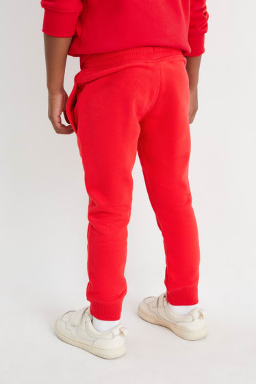 Dětské - Teplákové kalhoty - červená