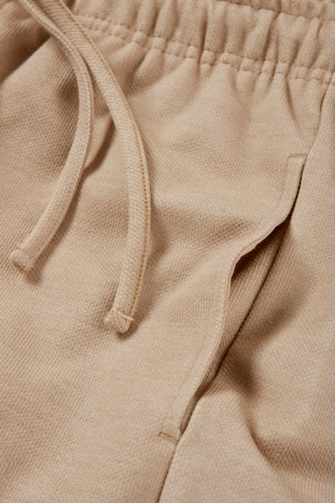 Uomo - Pantaloni sportivi - beige