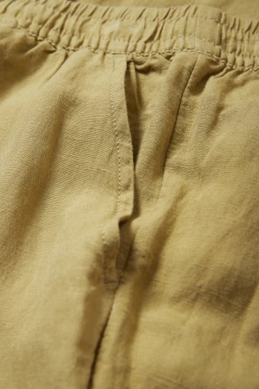 Kobiety - Spodnie materiałowe - średni stan - wide leg - miks lniany - musztardowy