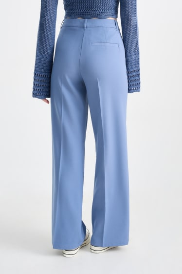 Jóvenes - CLOCKHOUSE - pantalón de tela - mid waist - wide leg - azul