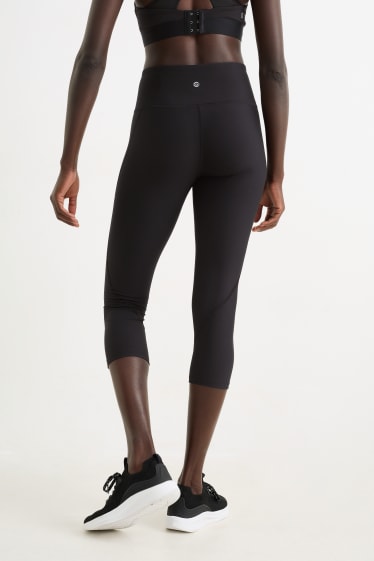 Kobiety - Sportowe legginsy rybaczki - efekt modelujący - 4 Way Stretch - czarny