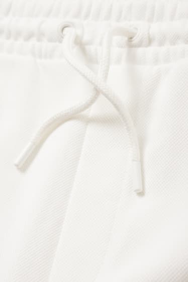 Pánské - Teplákové šortky - krémově bílá