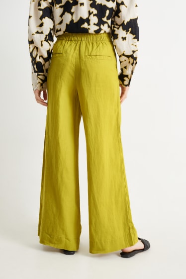 Kobiety - Spodnie lniane - wysoki stan - szerokie nogawki - żółty