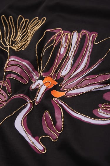 Dona - Samarreta de màniga curta amb cadenes aplicades - negre