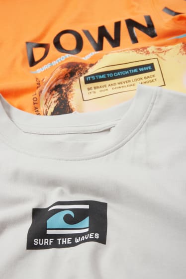 Niños - Pack de 2 - surfista - camiseta sin mangas y camiseta de manga corta - naranja