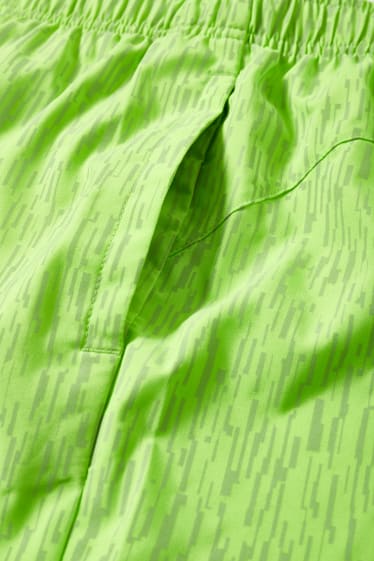 Pánské - Funkční šortky - neonově zelená