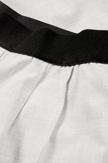 Adolescenți și tineri - CLOCKHOUSE - pantaloni de stofă - talie medie - wide leg - alb / negru