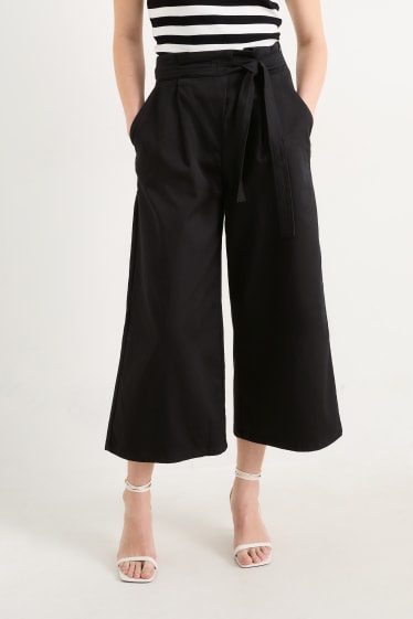 Kobiety - Spodnie materiałowe - wysoki stan - szerokie nogawki - czarny