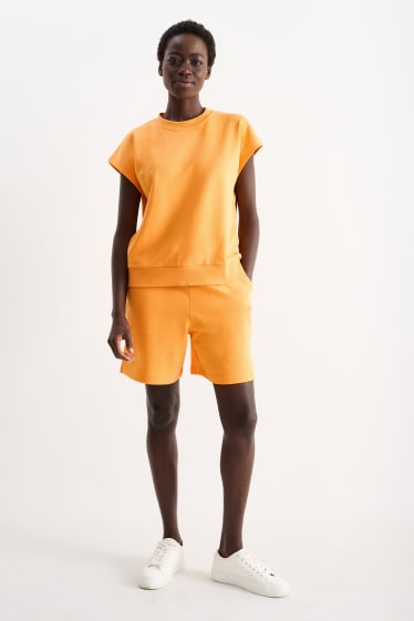 Dámské - Teplákové šortky basic - oranžová