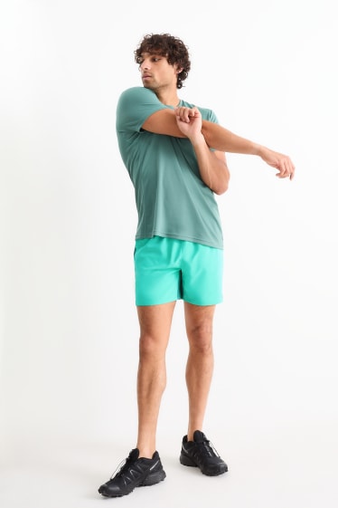 Bărbați - Pantaloni scurți funcționali - verde deschis