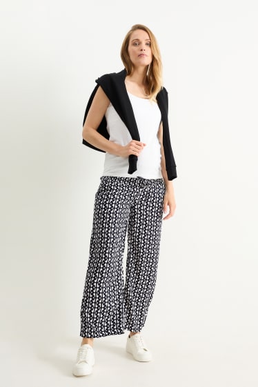 Donna - Pantaloni premaman - palazzo - fantasia - nero / bianco