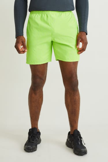 Home - Pantalons curts tècnics - verd fluorescent