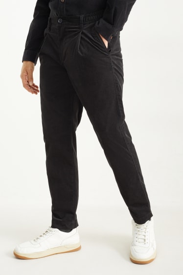 Uomo - Pantaloni chino in velluto - tapered fit - nero