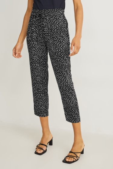 Dona - Pantalons de tela - high waist - tapered fit - estampats - negre