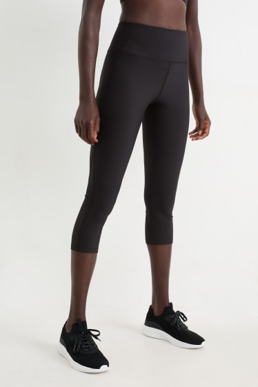 Kobiety - Sportowe legginsy rybaczki - efekt modelujący - 4 Way Stretch - czarny