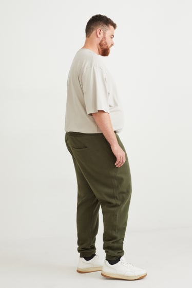 Uomo - Pantaloni sportivi - verde scuro