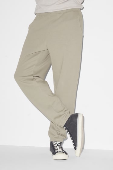 Pánské - Teplákové kalhoty - pískové barvy