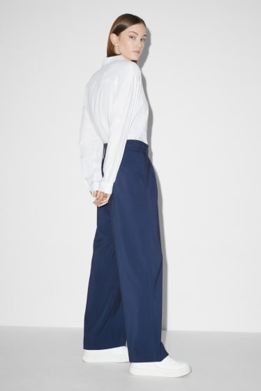Donna - CLOCKHOUSE - pantaloni di stoffa - vita media - gamba ampia - blu scuro