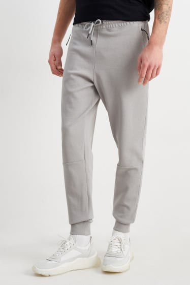 Uomo - Pantaloni sportivi - grigio