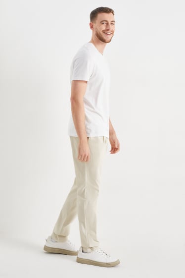 Uomo - Chino - tapered fit - Flex - bianco crema