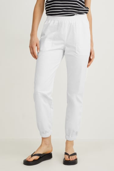 Dona - Pantalons de tela - mid waist - tapered fit - blanc