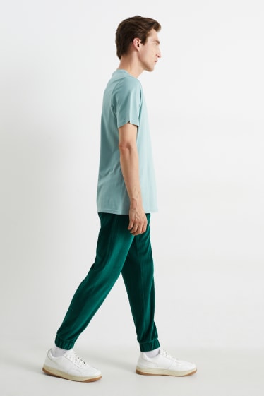 Herren - Samt-Jogginghose - dunkelgrün