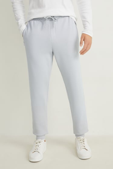 Uomo - Pantaloni sportivi - grigio chiaro