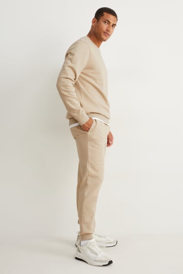 Uomo - Pantaloni sportivi - beige