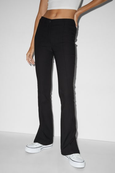 Dona - Pantalons de tela - mid waist - bootcut fit - negre