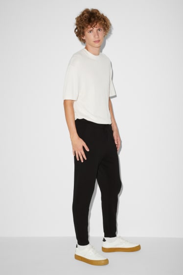 Uomo - Pantaloni in maglia - nero