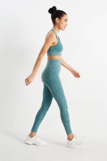 Kobiety - Sportowe legginsy - bez szwów - ochrona przed promieniowaniem UV - zielony