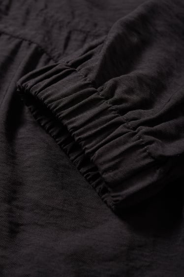 Damen - A-Linien Kleid mit V-Ausschnitt - schwarz