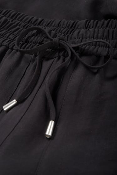 Dámské - Plátěné kalhoty - high waist - tapered fit - černá