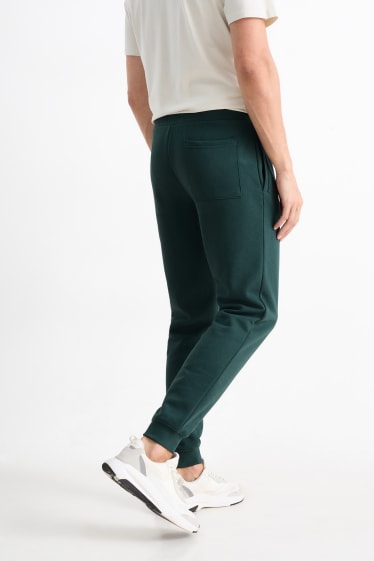 Hommes - Pantalon de jogging - vert foncé