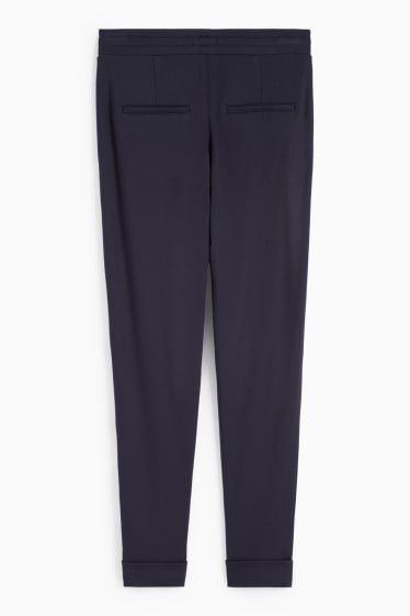 Kobiety - Spodnie z dżerseju - średni stan - tapered fit - ciemnoniebieski
