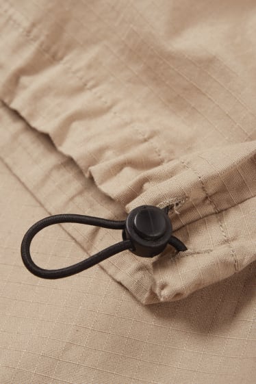 Mężczyźni - Spodnie spadochronowe - beżowy