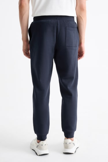 Pánské - Teplákové kalhoty - tmavomodrá