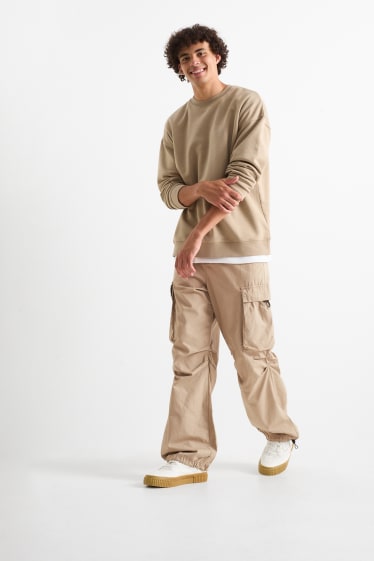 Mężczyźni - Spodnie spadochronowe - beżowy