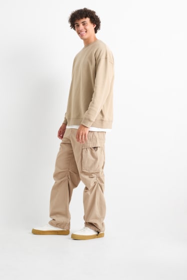 Mężczyźni - Spodnie spadochronowe - beżowy