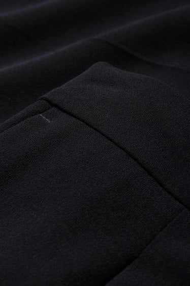 Kobiety - Spodnie materiałowe - wysoki stan - szerokie nogawki - czarny