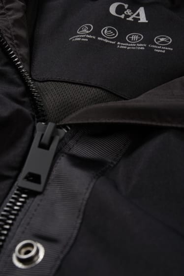 Damen - Regenjacke mit Kapuze - wasserdicht - schwarz