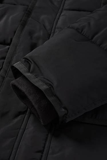 Home - Jaqueta embuatada amb caputxa - impermeable - negre