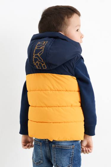Nen - Armilla embuatada amb caputxa - impermeable - groc