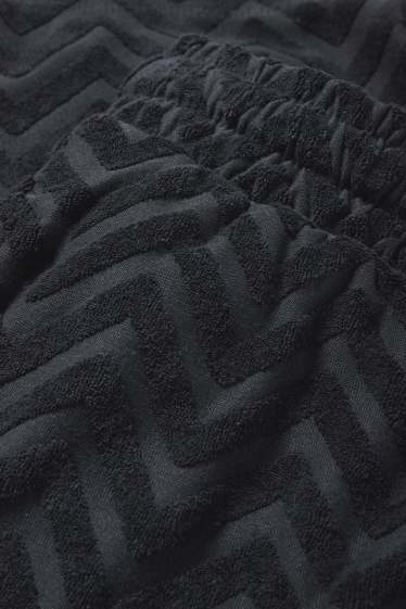 Men - Terry cloth shorts - patterned - black