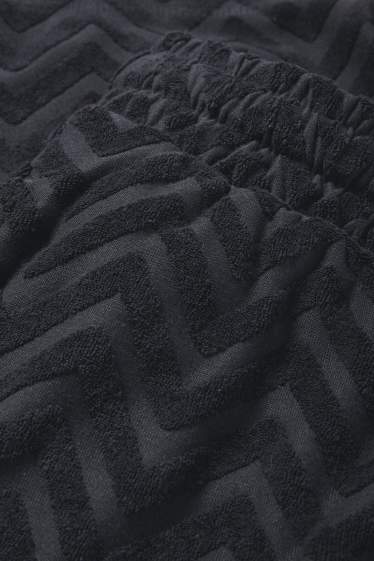 Men - Terry cloth shorts - patterned - black