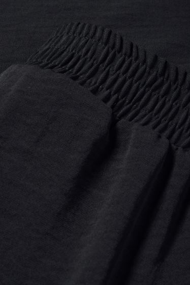 Women - Cloth trousers - high waist - wide leg - black