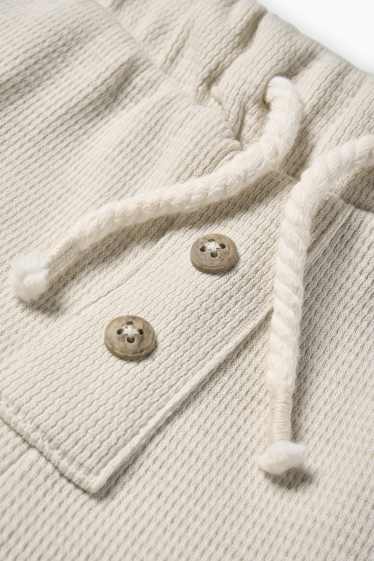 Baby: jongens - Babycargoshort - met structuur - beige