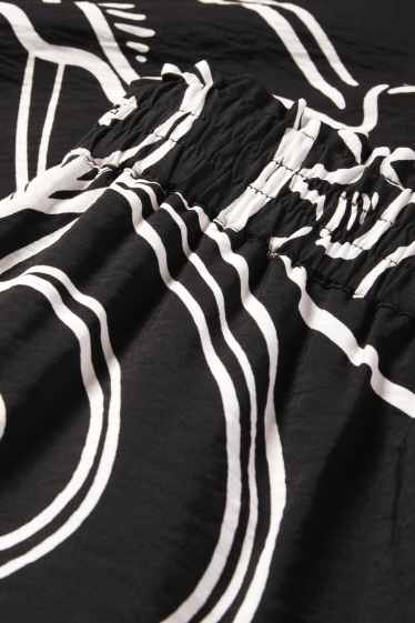 Femmes - Pantalon de toile - mid waist - loose fit - à motif - noir / blanc