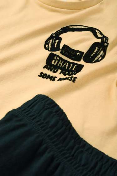 Kinder Buben - Kopfhörer - Set - Kurzarmshirt und Shorts - 2 teilig - hellorange