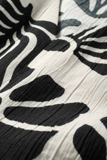 Femmes - Chemisier à col V et nœud - à motif - noir / beige